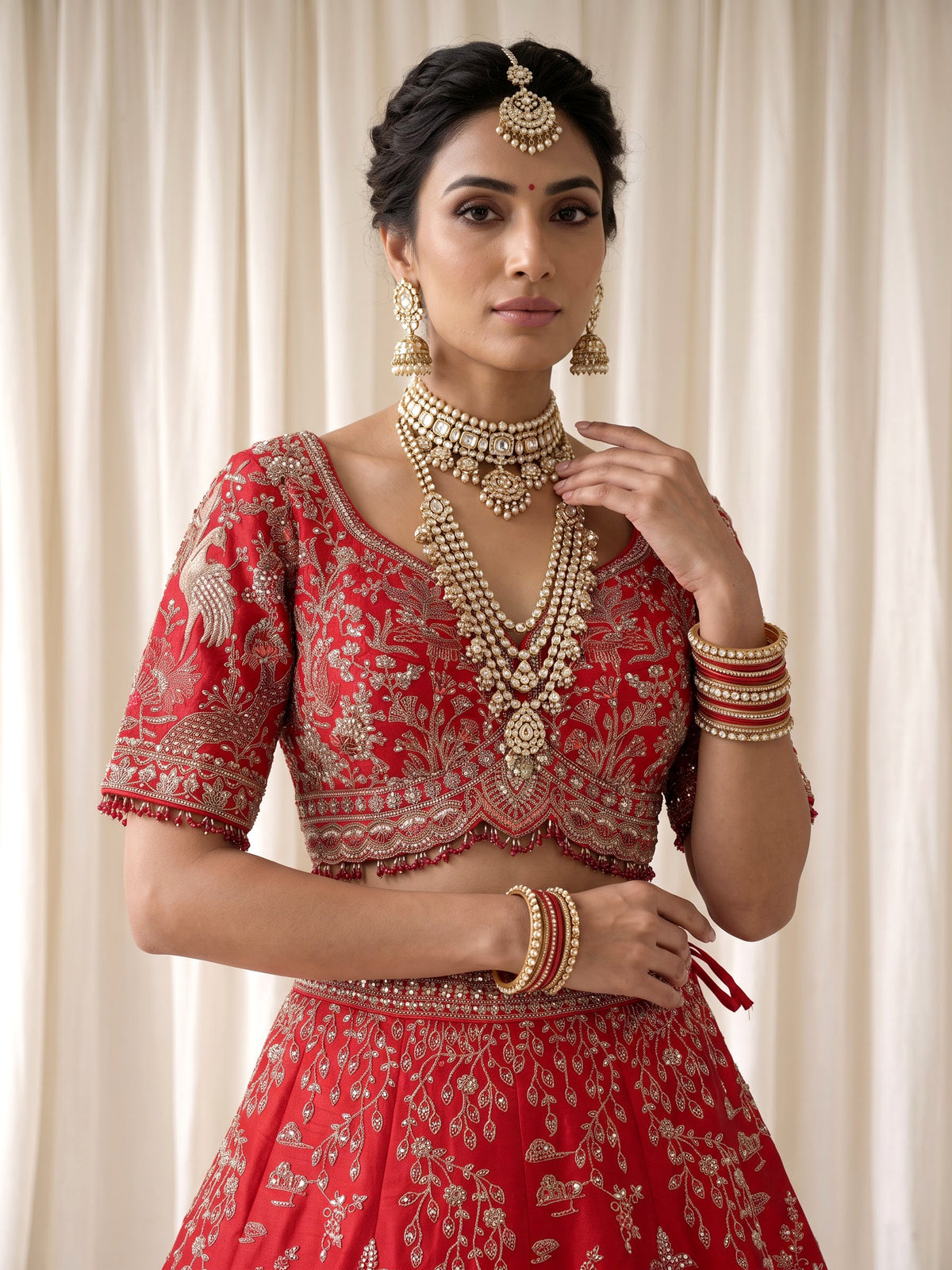 Red raw silk bridal lehenga with double dupatta and art motifs