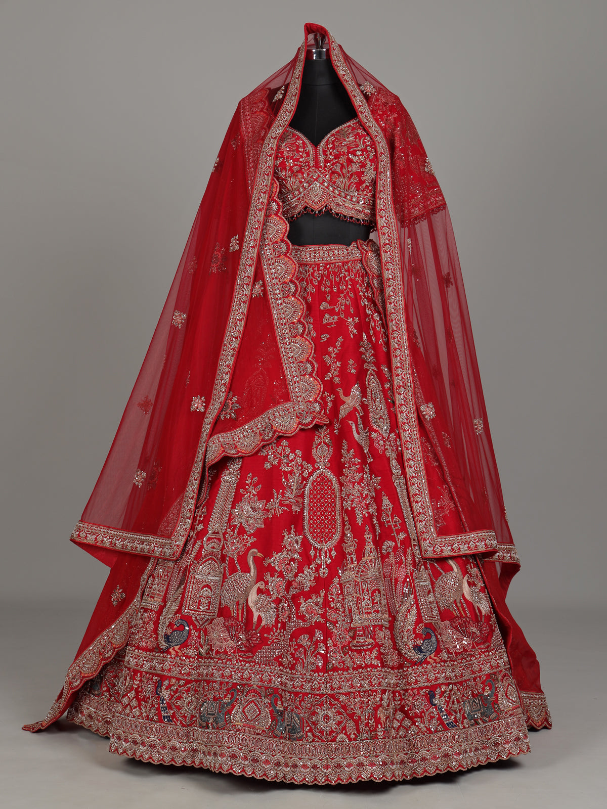 Red raw silk bridal lehenga with double dupatta and art motifs