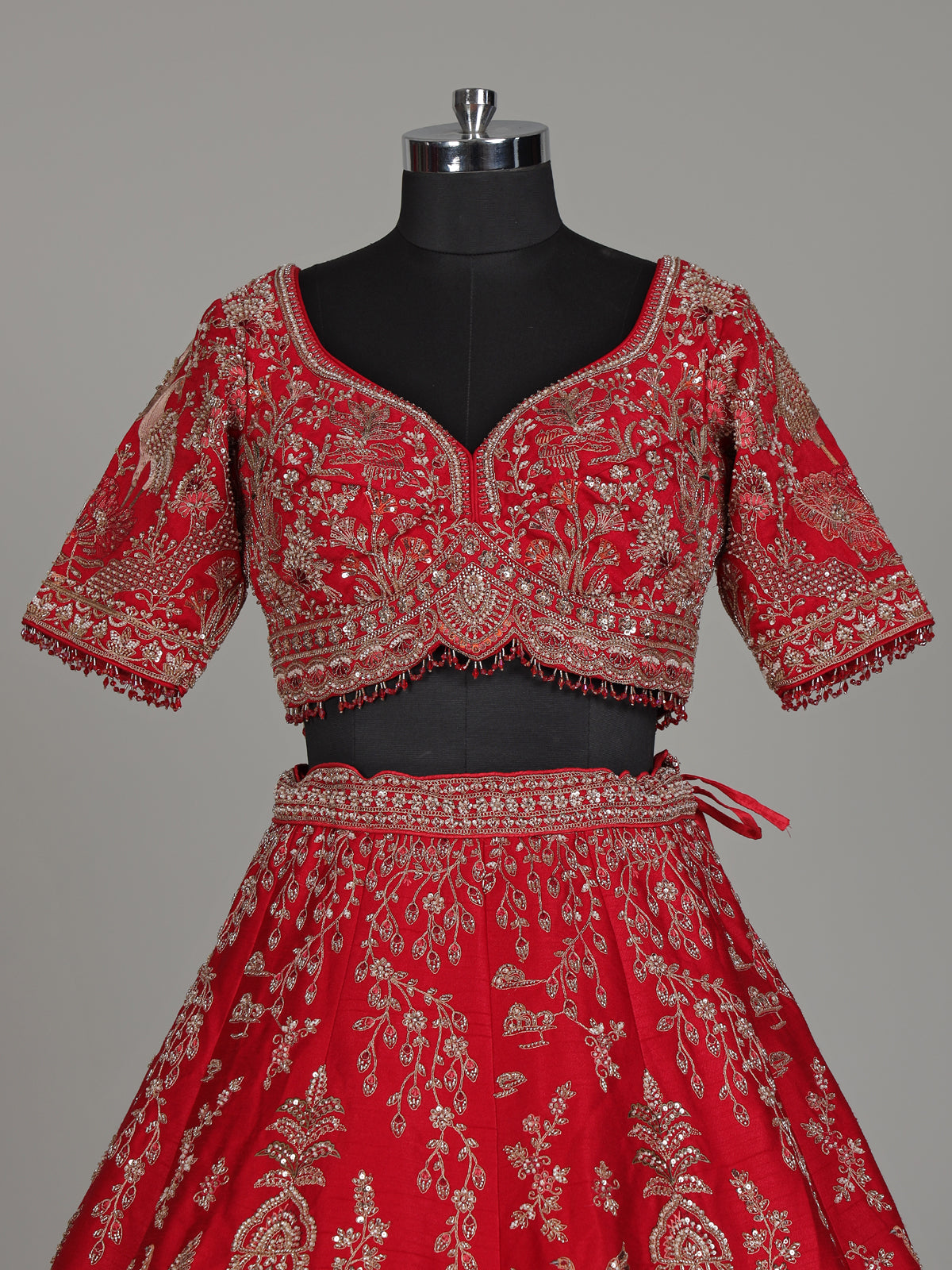 Red raw silk bridal lehenga with double dupatta and art motifs