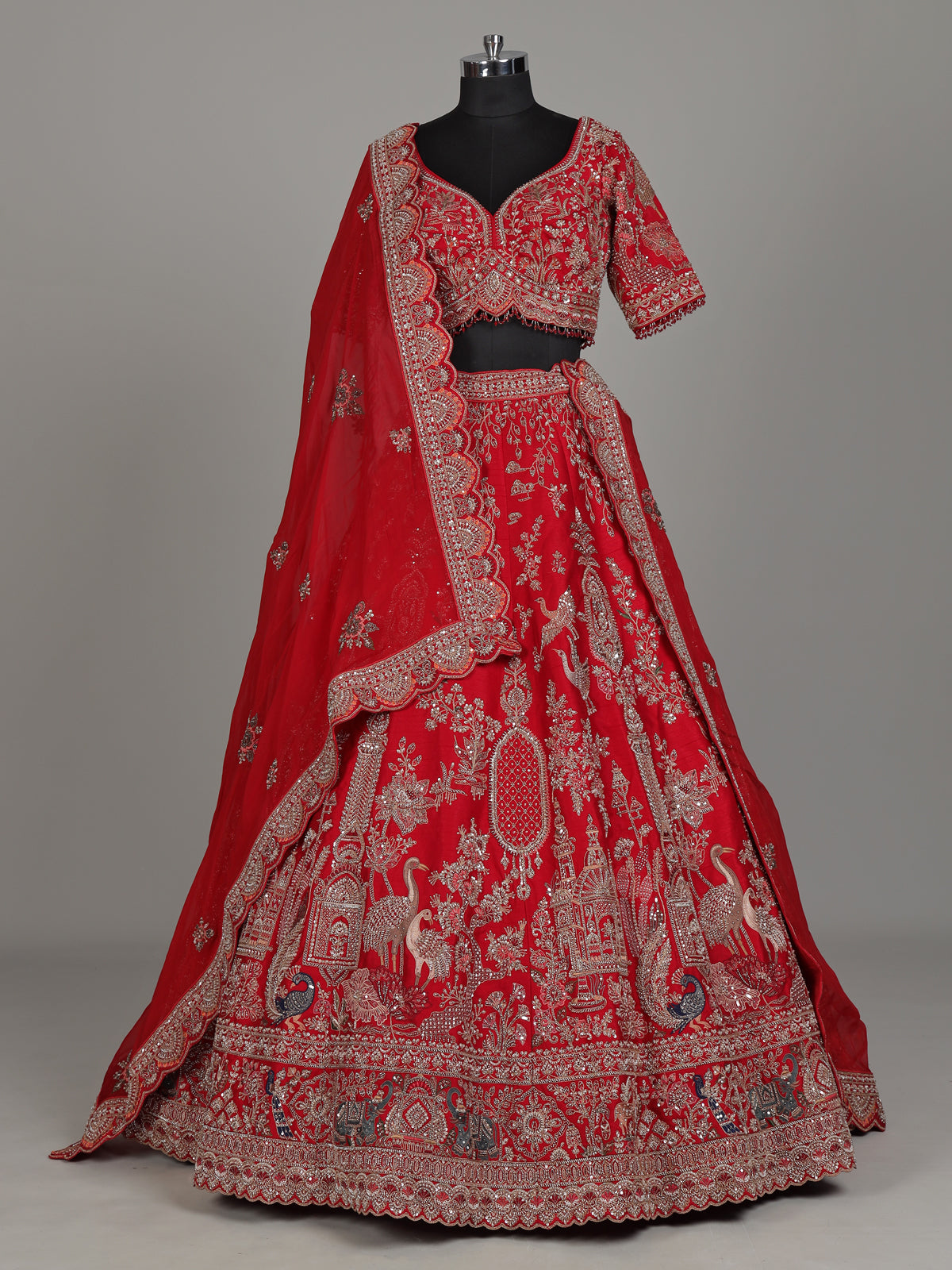 Red raw silk bridal lehenga with double dupatta and art motifs