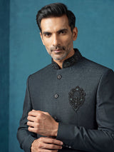 Deep emerald green textured jodhpuri suit for mens with crest