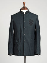 Deep emerald green textured jodhpuri suit for mens with crest