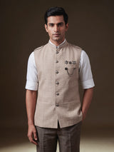 Beige textured waistcoat with metallic chain brooch detailing for mens