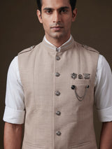 Beige textured waistcoat with metallic chain brooch detailing for mens