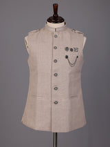 Beige textured waistcoat with metallic chain brooch detailing for mens