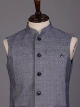 Grey micro-textured waistcoat with metallic brooch for mens weddings