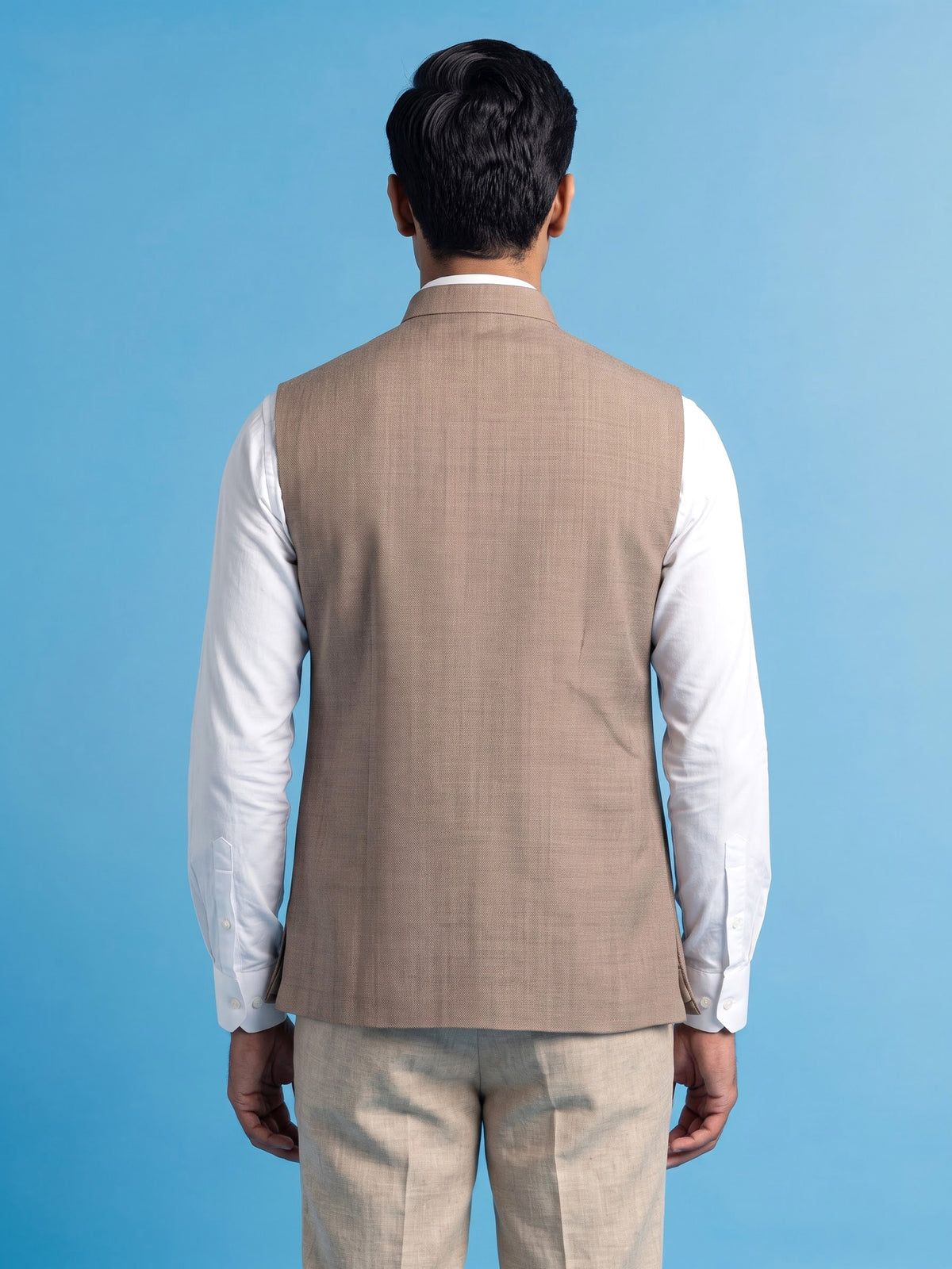 Dark beige textured waistcoat with zardosi safari pocket detailing