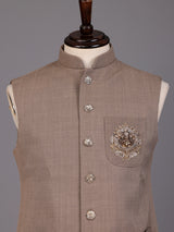 Dark beige textured waistcoat with zardosi safari pocket detailing
