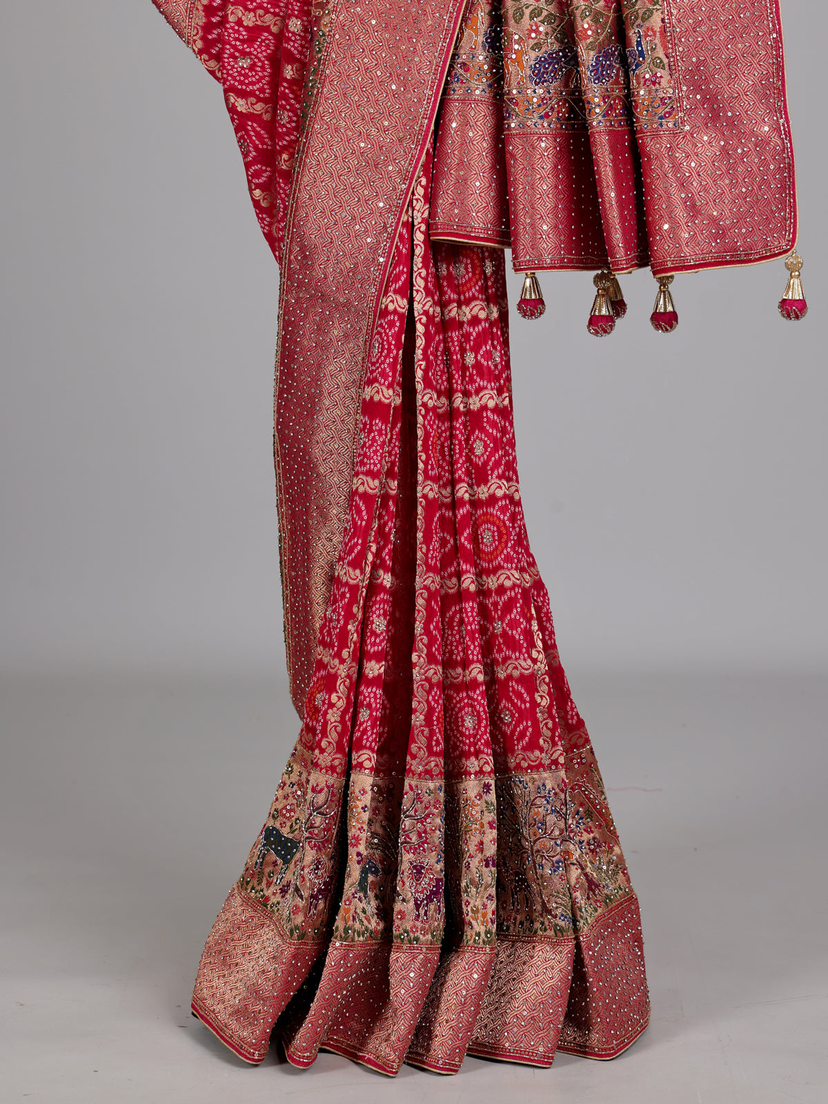 Rani pink Bandhani pattern figurative embroidered festive saree