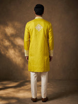 Mustard yellow silk kurta suit with ornate embellished yoke
