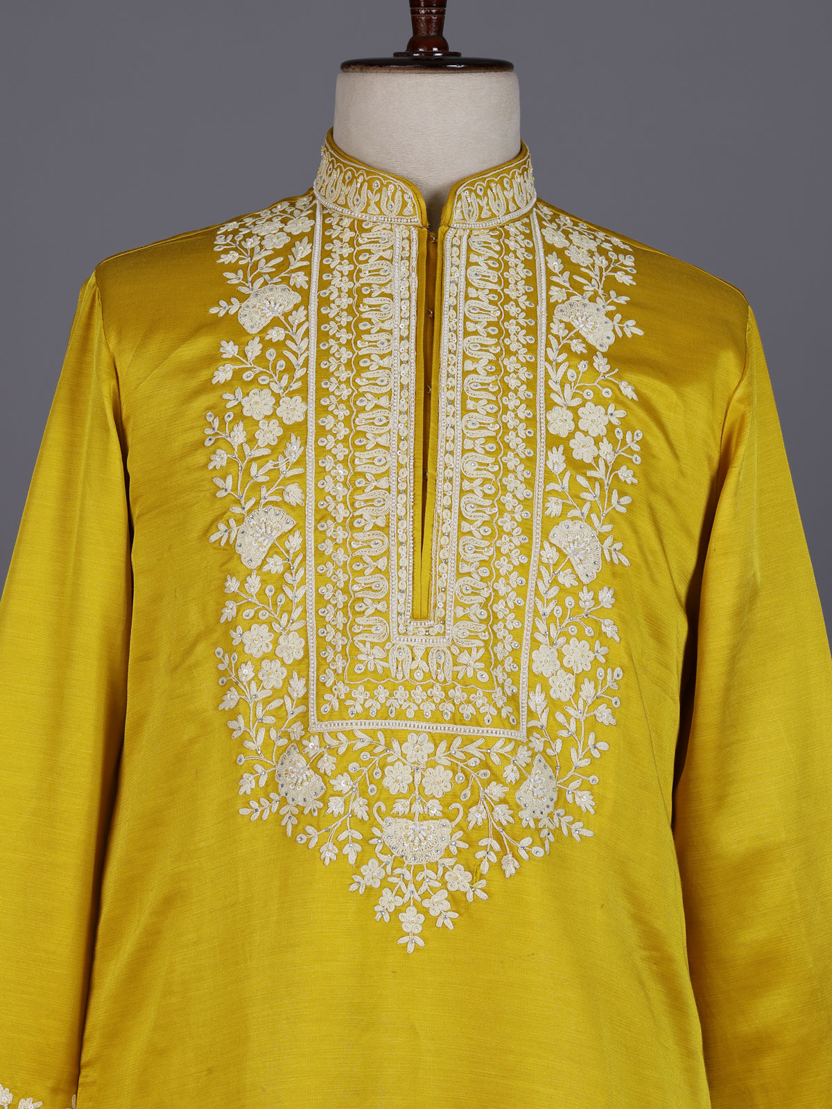Mustard yellow silk kurta suit with ornate embellished yoke