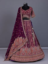 Purple silk lehenga choli with chevron panels and embellished drape