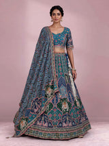 Rama green silk lehenga choli with bandhani patola detailing