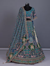 Rama green silk lehenga choli with bandhani patola detailing