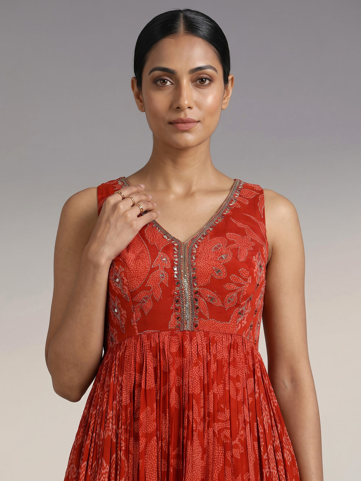 Rust red printed georgette silk anarkali with aabla embellishments