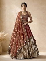 Rust red silk lehenga choli with intricate aabla embroidery