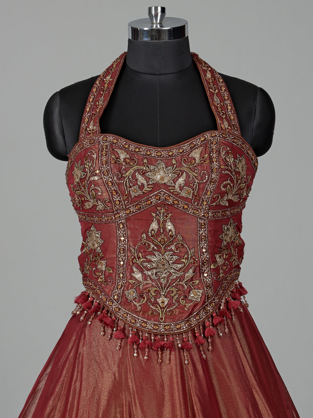 Rust red silk lehenga choli with intricate aabla embroidery