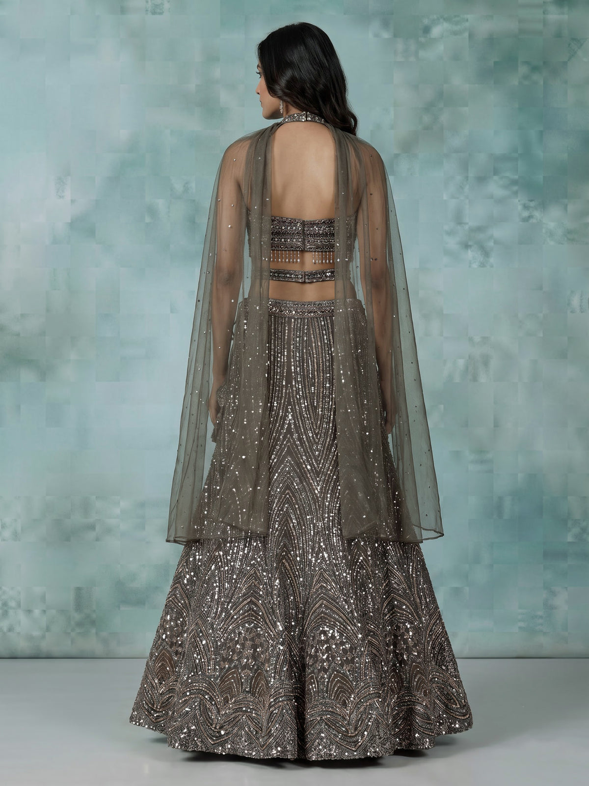 Dark mehendi green silk lehenga choli with diamond embellishments