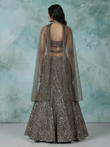 Dark mehendi green silk lehenga choli with diamond embellishments