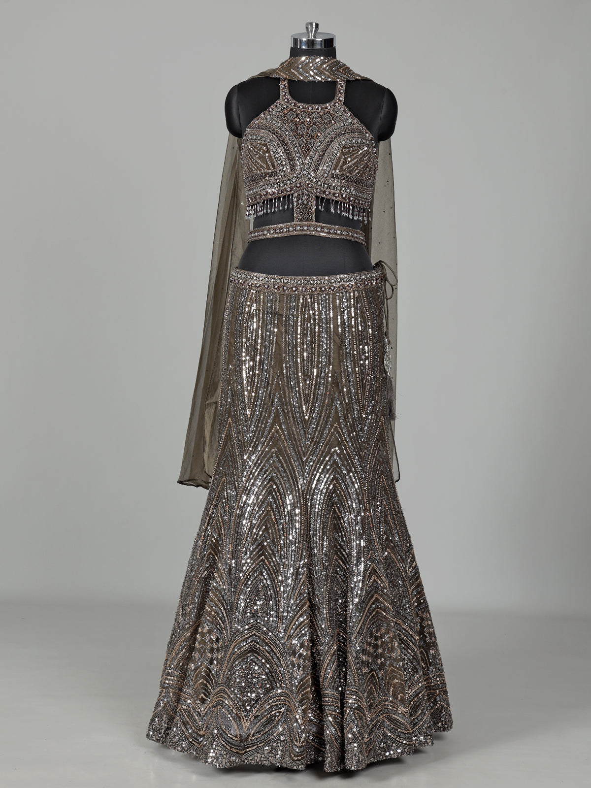 Dark mehendi green silk lehenga choli with diamond embellishments
