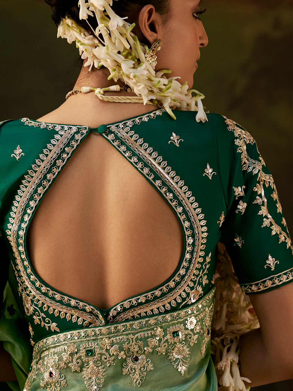 Green stone embellished tissue silk women saree