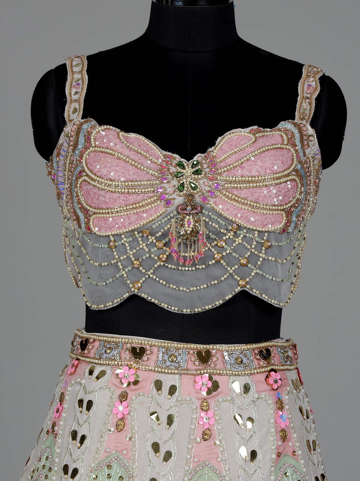 Beige silk lehenga choli with pearl and diamond embellishments