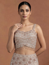 Beige chiffon silk lehenga choli with diamond and tassel detailing