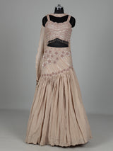 Beige chiffon silk lehenga choli with diamond and tassel detailing