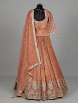 Pastel peach silk lehenga choli with elegant zardosi embroidery