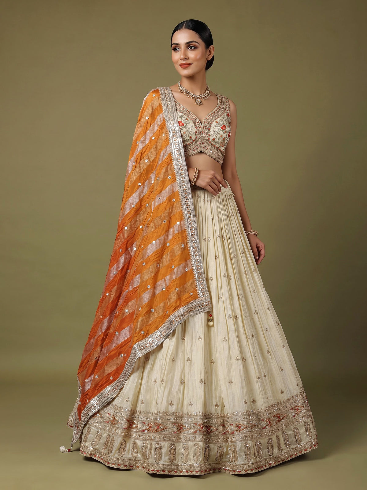 Beige silk lehenga choli with mirror work and contrast dupatta