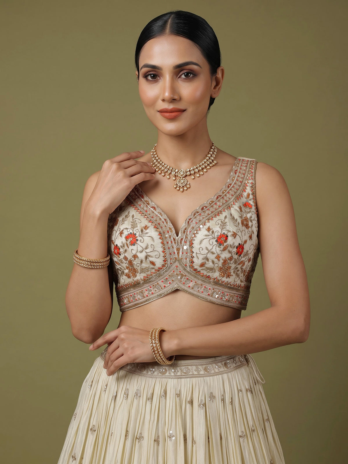 Beige silk lehenga choli with mirror work and contrast dupatta