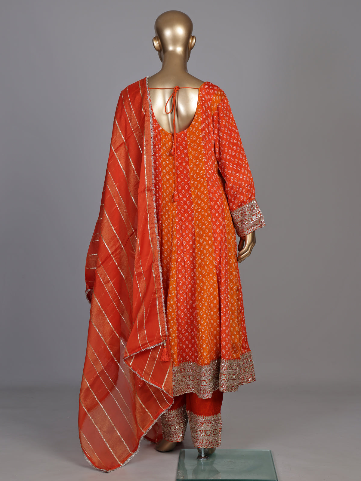 Rust orange modal silk anarkali suit with embroidered neckline