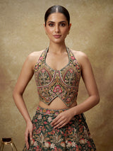 Green silk floral lehenga choli with halter neck embellishments