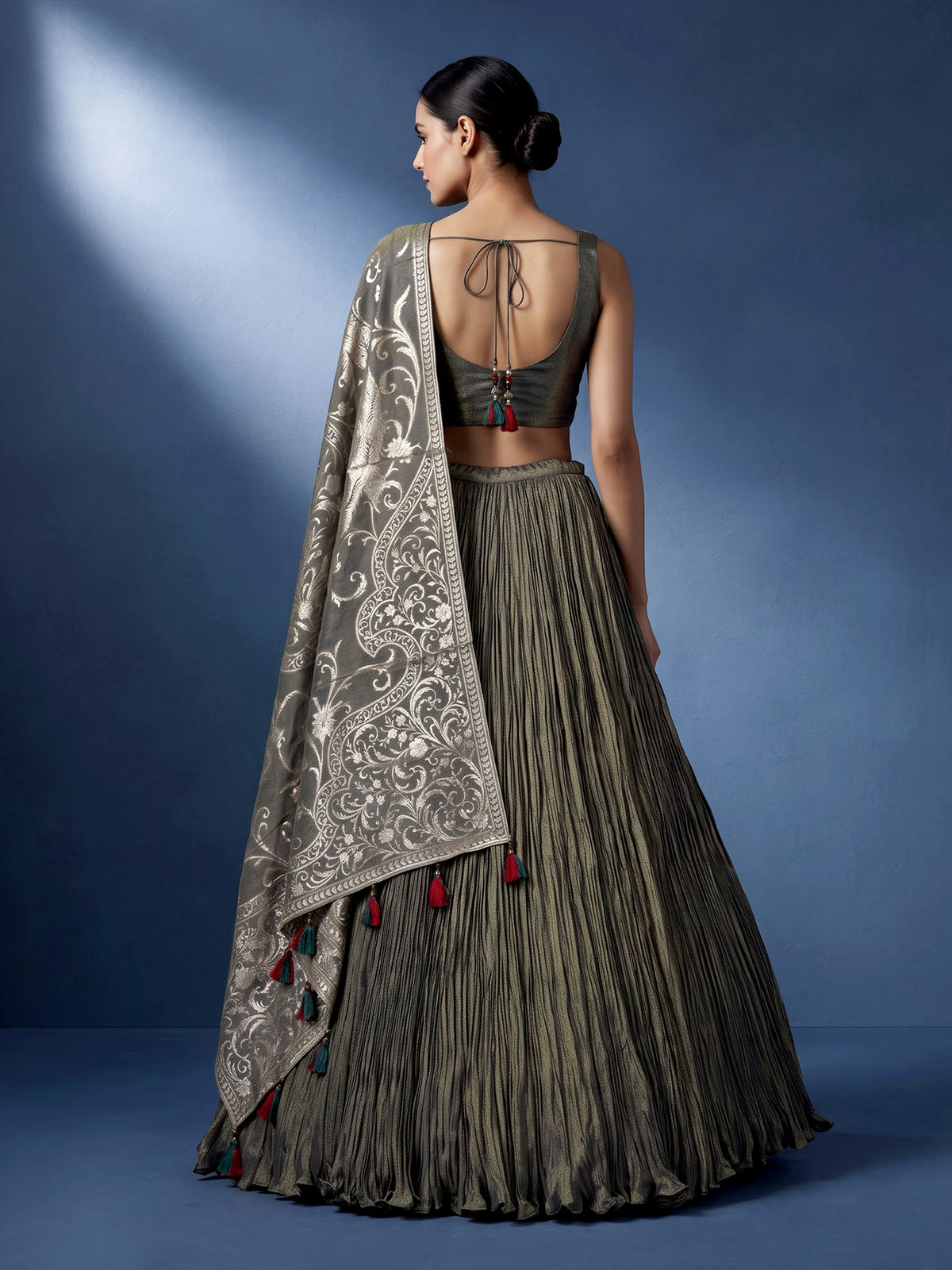 Pastel mehendi green silk lehenga choli with pearl embellishments