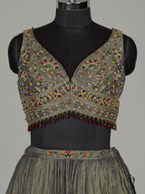Pastel mehendi green silk lehenga choli with pearl embellishments