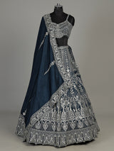 Peacock blue silk lehenga choli with heavy tassel embellishments