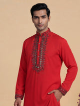 Scarlet red crepe silk kurta suit with antique silver embellished bib