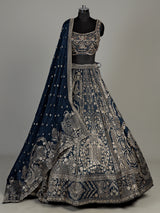 Teal blue silk lehenga choli with square neck zari embellishments