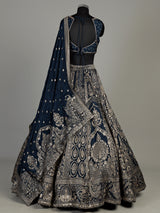 Teal blue silk lehenga choli with square neck zari embellishments
