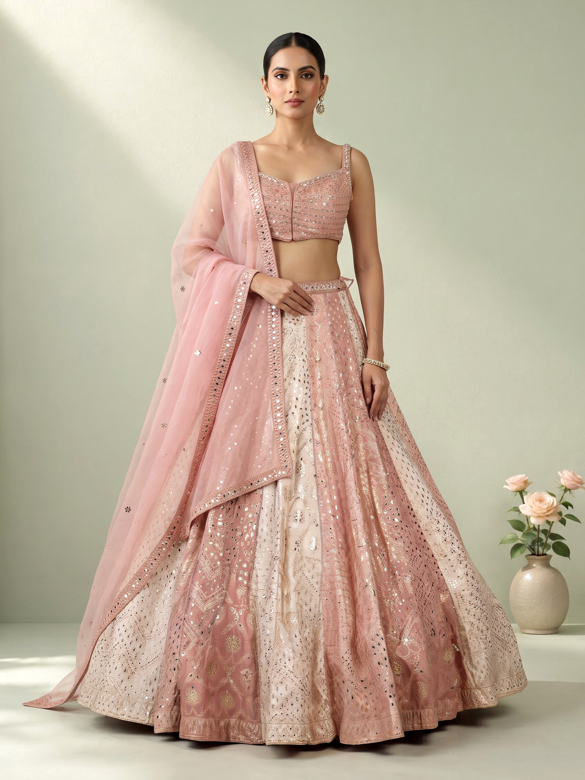 Peach silk lehenga choli with exquisite mirror zari embellishments
