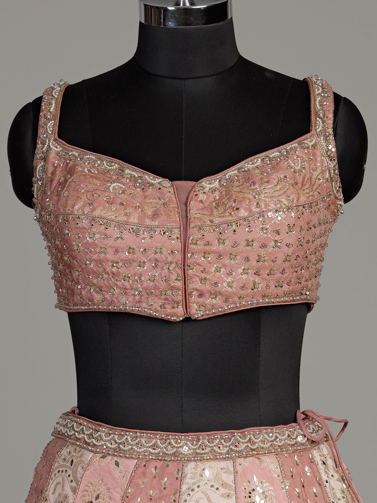 Peach silk lehenga choli with exquisite mirror zari embellishments