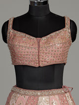 Peach silk lehenga choli with exquisite mirror zari embellishments