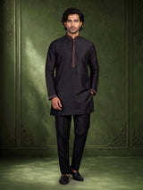 Black raw silk waistcoat set with antique gold floral brocade