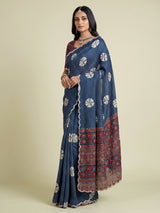 Blue crepe silk saree with printed patterns and traditional aabla work