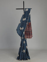 Blue crepe silk saree with printed patterns and traditional aabla work