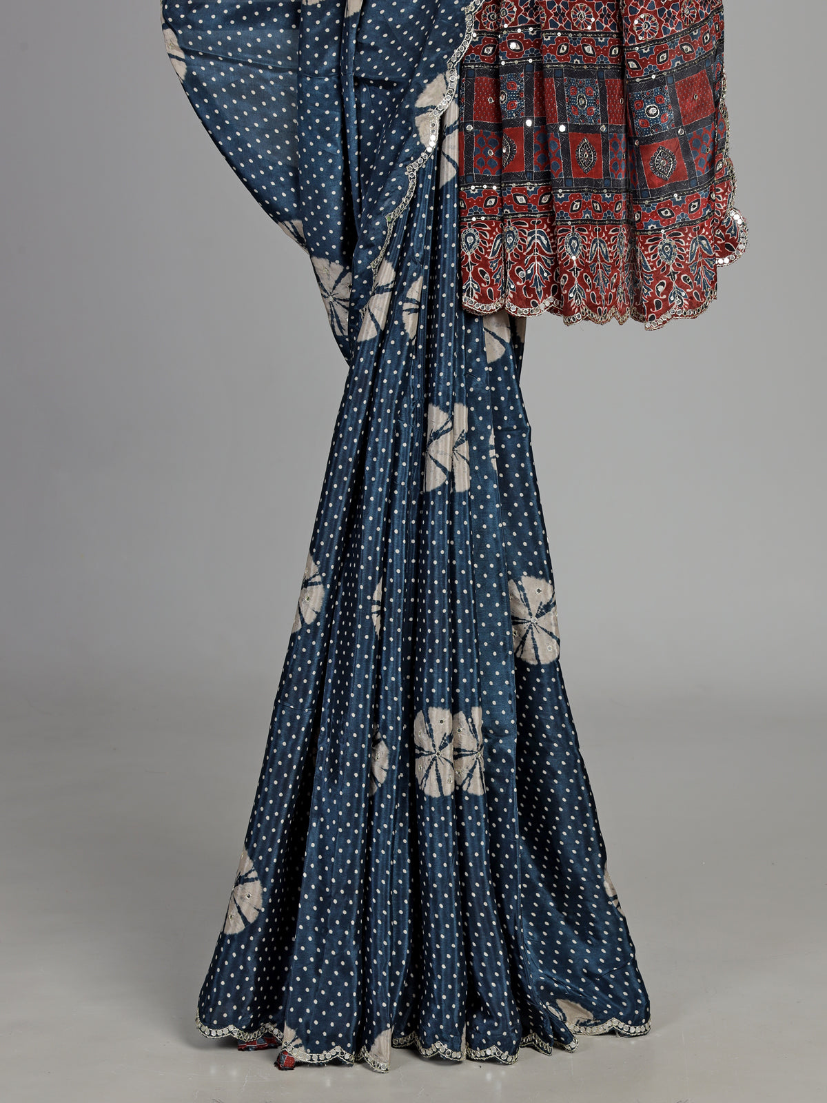 Blue crepe silk saree with printed patterns and traditional aabla work