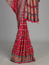 Deep rani pink modal satin saree with colourful motifs and embellishments