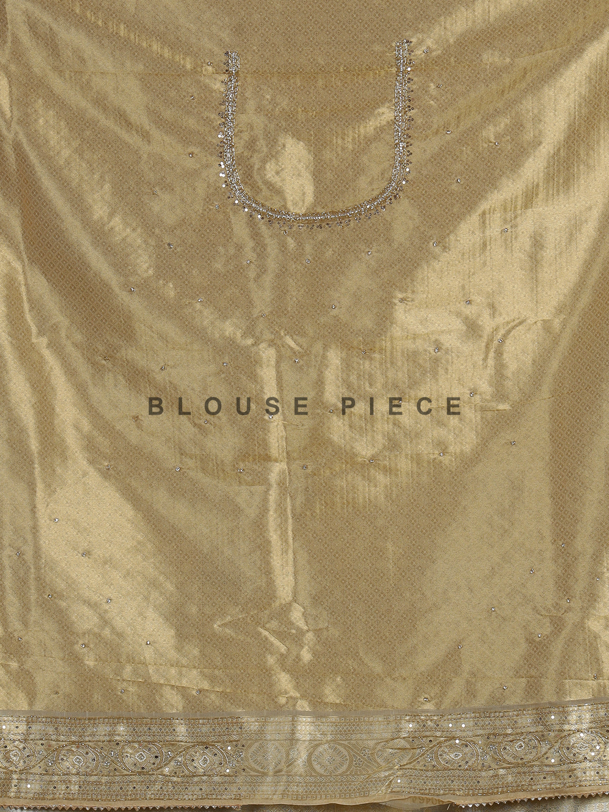 Pastel cream tissue silk saree with intricate festive embellishments and zari