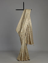 Pastel cream tissue silk saree with intricate festive embellishments and zari