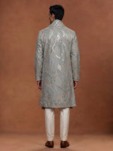 Pastel mint blue silk kurta set with embellished swirl embroidery